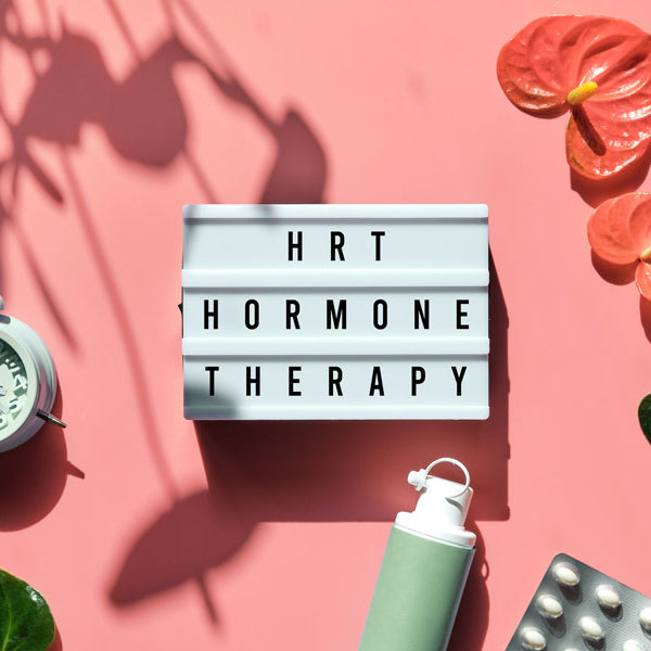 hrt hormone therapy words with flowers and clock